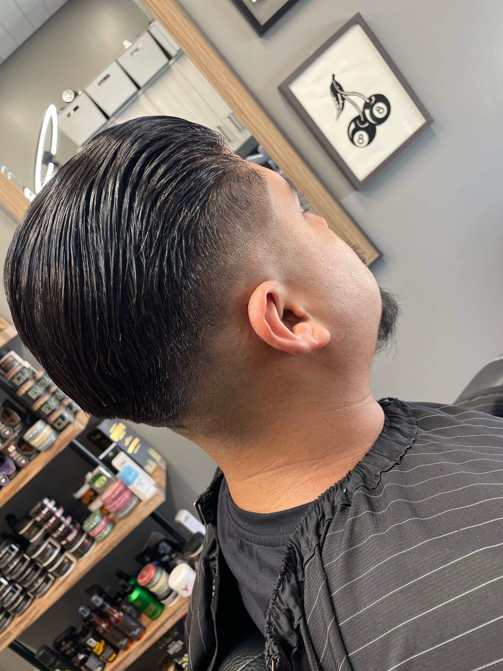 Slick back and taper haircut by LV Barbershop